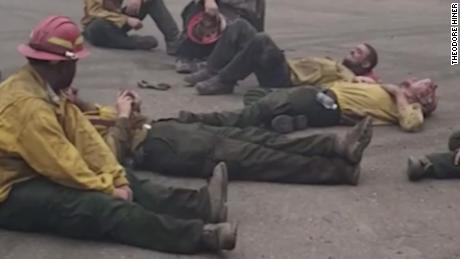Exhausted firefighters sing together after a 14-hour shift to fight wildfires in Oregon 