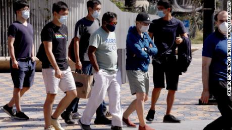 Pedestrians wear masks on their way to Santa Monica on September 29th.