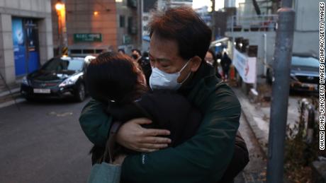 A father hugs his daughter during a college entrance exam on December 3, 2020 in Seoul, South Korea, amid a corona virus infection. 