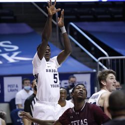 BYU forward Gideon George (5) puts in a shot as Texas Southern forward Jordan Carl Nichols (5) appears during the Cooks' 87-71 victory at the Marriott Center in Provo on Monday 21 December 2020.