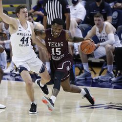 BYU guard Connor Harding (44) defends Texas South forward Justin Hopkins (15) during the Cooks' 87-71 victory at the Marriott Center in Provo on Monday, December 21, 2020.