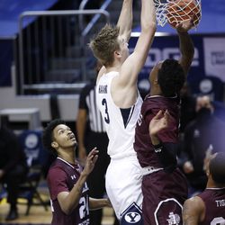 BYU center Matt Harmes (3) sank the ball as the Cougars surrounded all three of the southern defenders during the 87-71 victory at the Marriott Center in Provo on Monday 21 December 2020.