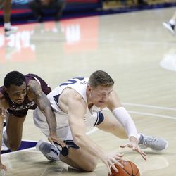 BYU forward Colby Lee (40) sank to the ground for a loose ball during the Cookers' 87-71 win over Texas Southern at the Marriott Center in Provo on Monday, December 21, 2020.