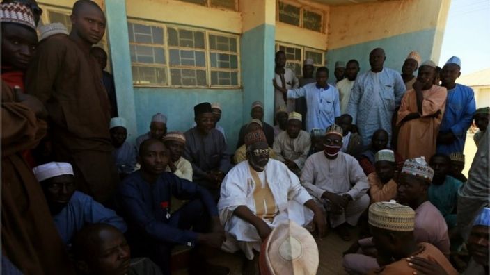 Parents gather during a meeting at a government science school after students were abducted by gunmen on December 13, 2020, in Kangar, in the northwestern Katsina state of Nigeria.