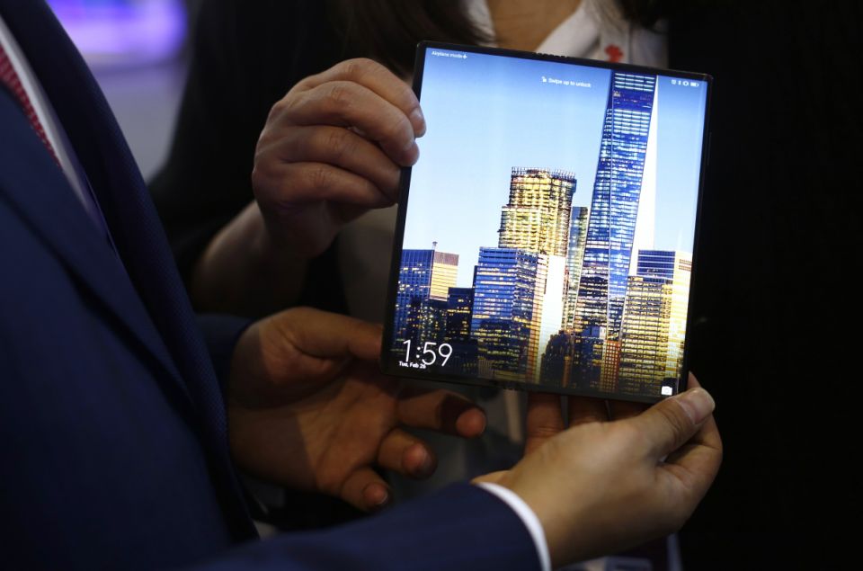 A man holds the new Huawei Mate X 5G foldable smartphone during the Mobile World Congress in Barcelona, ​​Spain on Tuesday, February 26, 2019. The annual Mobile World Congress (MWC) will be held February 25-28 in Barcelona, ​​where businesses from all over the world meet in the world to share new products.  (AP Photo / Manu Fernandez)