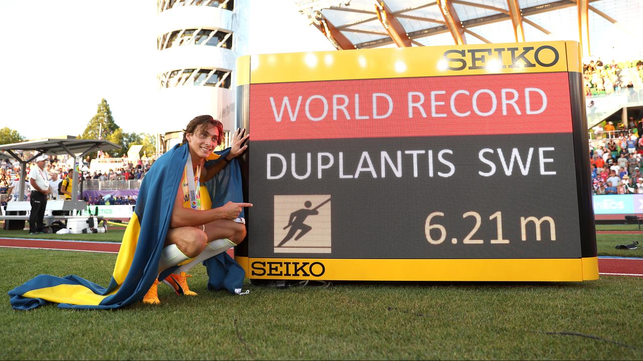 Armand Duplantis poses with the new world record.