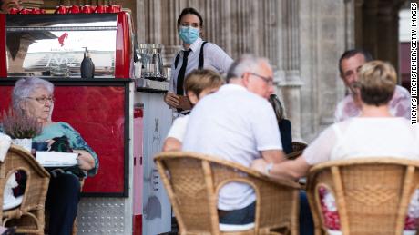 An employee in Vienna wears a mask on September 14 according to new, stricter rules enacted by the Austrian government.