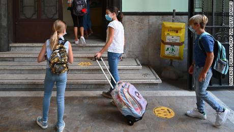 The masked students arrive at the Luigi Inadi Technical High School in Rome, Italy on September 14 to begin the school year.