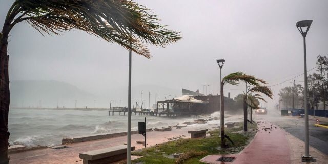 On Friday, September 18, 2020, waves break at a seaside restaurant during a storm at the port of Argostoli on the Ionian island of Kefalonia in western Greece.