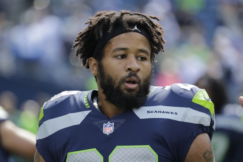 Earl Thomas stands on the field while warming up with the Seahawks ahead of an NFL game in 2018.