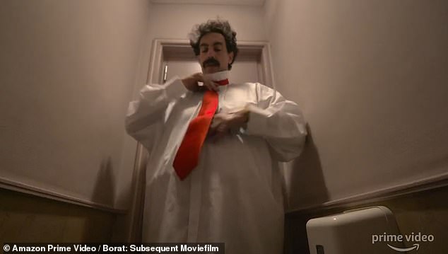 Another still from the film shows Cohen (fighting) putting his Trump costume together