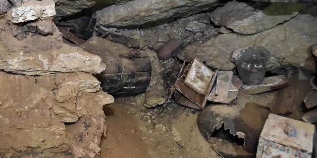 Officials say the unpublished photo, provided by the Egyptian Ministry of Tourism and Archeology, shows ancient coffins and artifacts unearthed by Egyptian archaeologists in a vast necropolis south of Cairo on Monday, October 19, 2020 in southern Cairo.