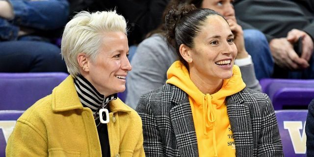USWNT forward Megan Robino, left, and Seattle storm guard Sue Bird enjoying a game on January 27, 2019 at the Alaska Airlines Arena in Seattle, Washington.  (Getty Images)