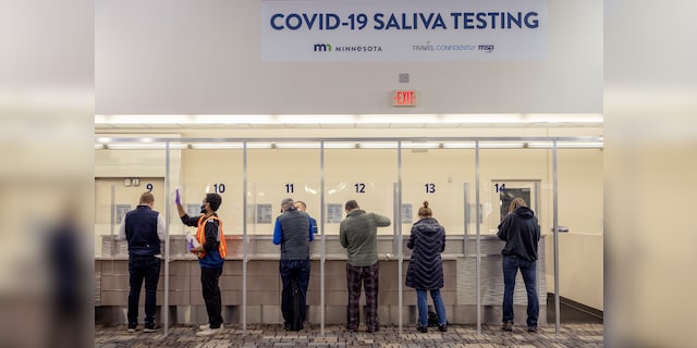 People are being tested at the new saliva COVID-19 test site in Minneapolis-St.  Paul International Airport, Thursday, November 12, 2020. (via Elizabeth Flores / Star Tribune AP)
