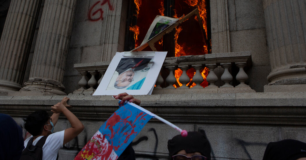 In Guatemala, protesters set fire to a congressional building to cut costs