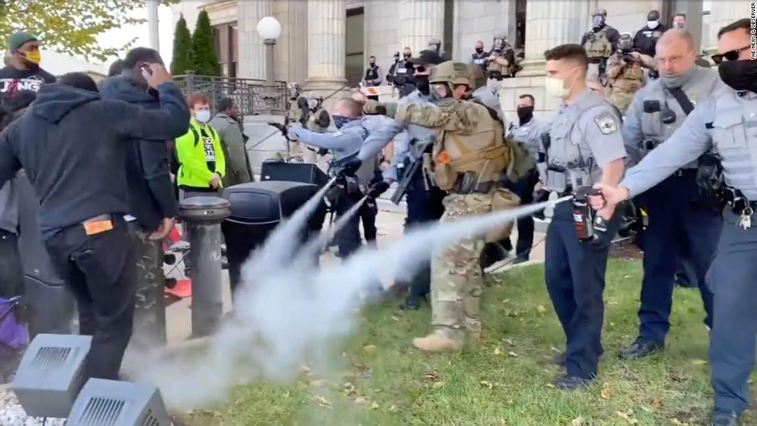 Police used pepper spray to break up a North Carolina march into a polling station