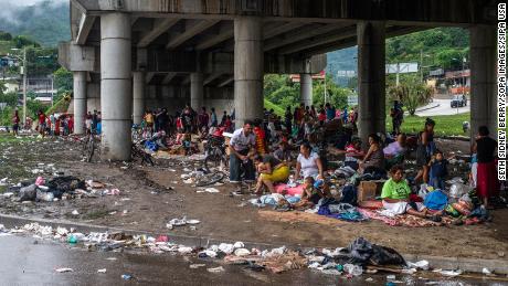 People forced to evacuate their homes in the Sula Valley of San Pedro due to flooding after Hurricane Eta are taking refuge in a makeshift camp under a bypass in Semelegon, Honduras.