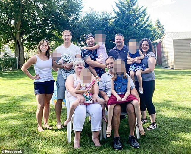 The picture of Karen sitting down with her family has been on the ventilator for 13 days