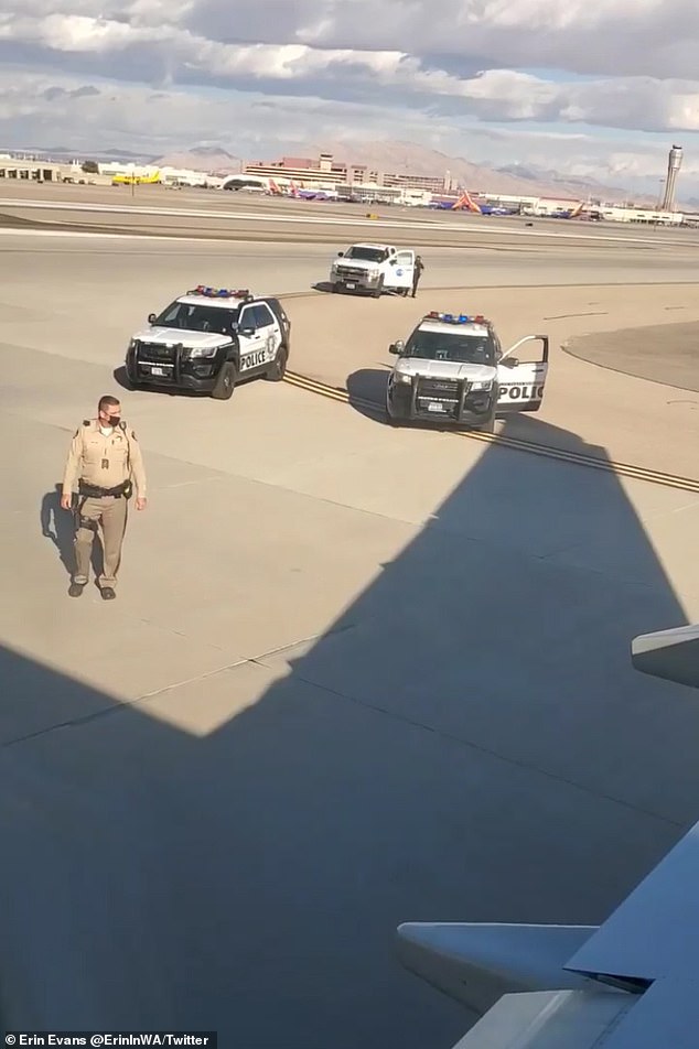 When police officers approached him, he moved toward the plane's vertical winglet