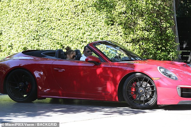 Driving in style: Alex took both of them to his gym in his Red Porsche GTS