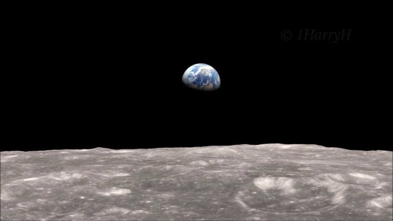 The gray of the half-earth moon floats in the black sky on the Great Surface.