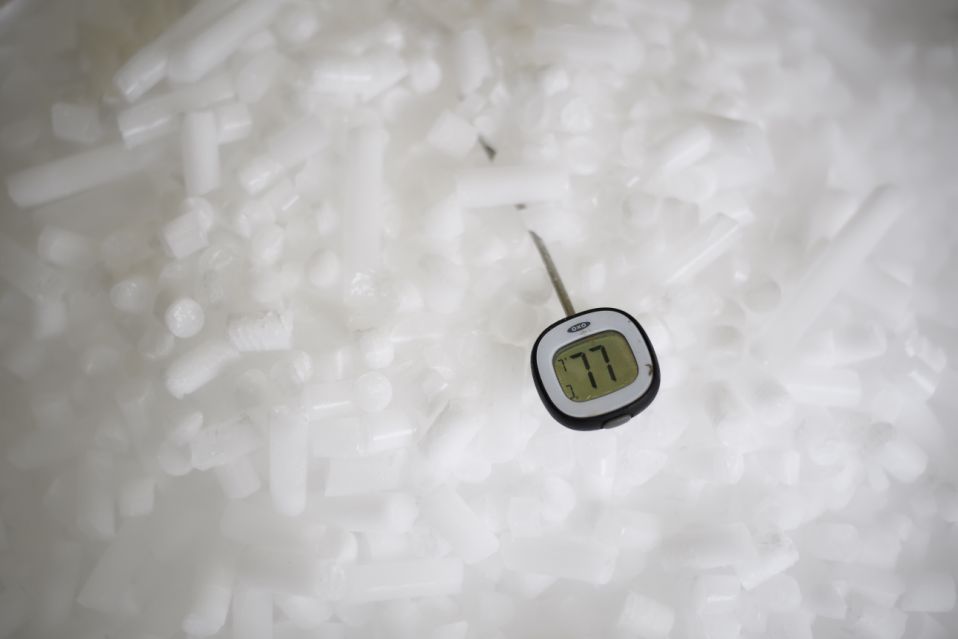 Reading, UK - November 11: A thermometer shows a temperature of -77 degrees centigrade in the distribution of coarse dry ice particles at a dry ice production plant nationwide on November 11, 2020 in Reading, UK.  The company produces dry ice in a variety of forms and provides coarse particles and layers for use in temperature control pharmaceuticals, pathological environments and chemical laboratories and in food transport.  The Covit-19 vaccine, developed by Pfizer and Bioendech, must be kept at extreme cold temperatures during the journey from the production line to the patient's hand.  To meet this challenge, Pfizer created a suitcase-sized box that holds 1,000 to 5,000 doses of dry ice at minus 70 degrees Celsius for 10 days.  (Photo by Leon Neil / Getty Images)