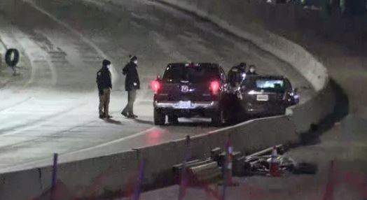 Police say driver pulled a Detroit officer's car against a wall on an I-75 and opened fire