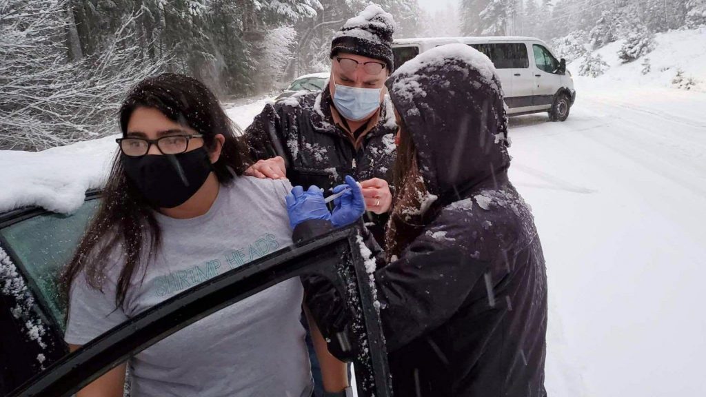Who wants a shot?  US healthcare workers stuck in snow with vaccines