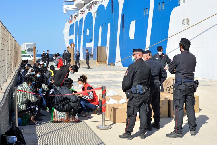Under the supervision of Italian police, migrant minors await the departure of the Lampedusa ferry on Thursday. Image / Salvatore Cavalli / AP
