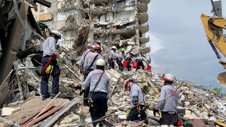 Rescue teams are working on the unstable cement and steel mounds in hopes of finding survivors.  Image via REUTERS