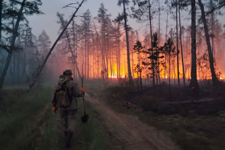 A volunteer goes to try to contain a forest fire in the eastern region of Russia in Yakutia.  AP Image