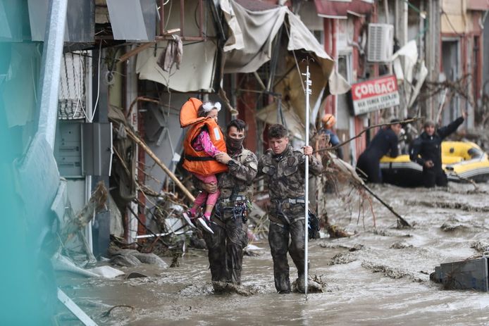 Emergency services rescue a girl after flooding in Bozkurt, a town in one of the Black Sea regions.