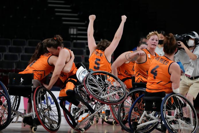 Wheelchair basketball players are celebrating.