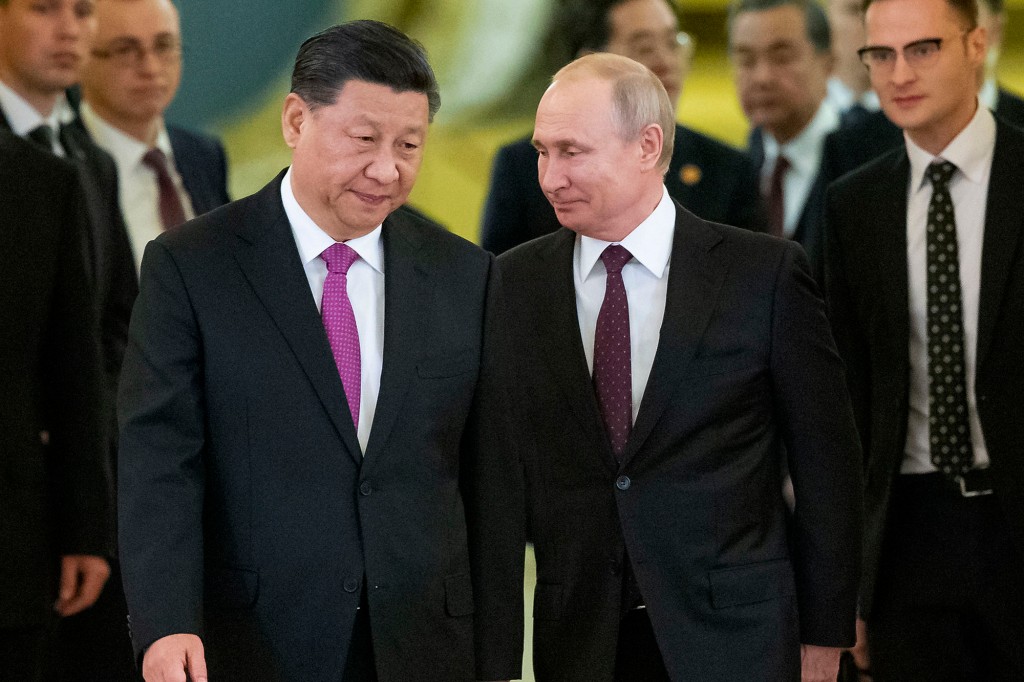 Vladimir Putin (right) has said he plans to meet with President Xi Jinping (left) in February to attend the Olympics. 