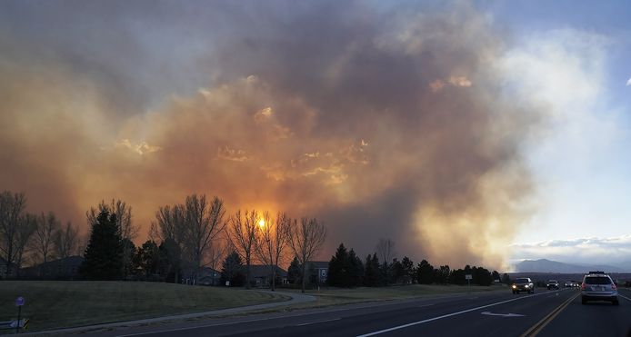 Clouds of smoke rise above Boulder, where authorities have ordered residents of two towns to evacuate their homes.