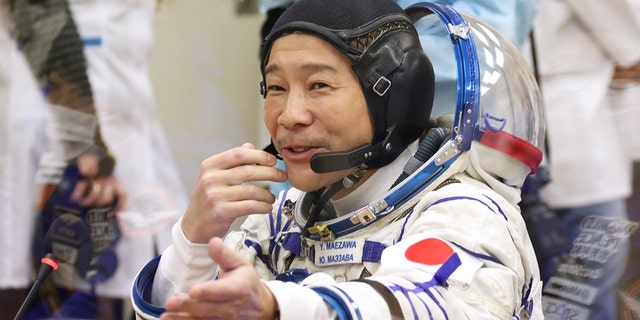 Space flight participant Yusaku Maezawa from Japan sees the launch at Russia's Baikonur Chartered Cosmodrome, Kazakhstan, Wednesday, December 8, 2021. 