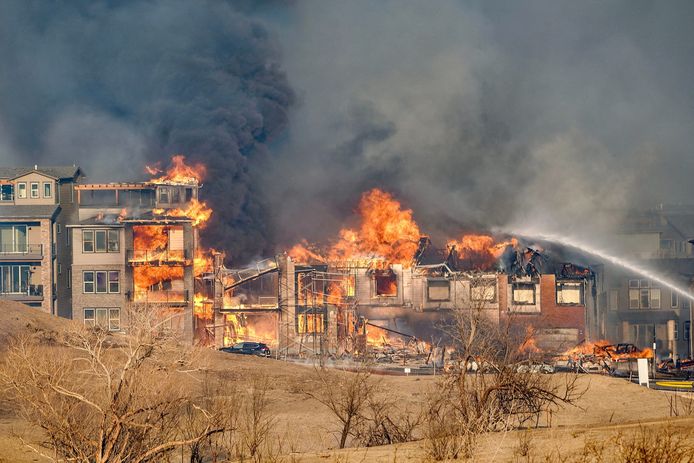 Homes ignite after wildfires in suburb of Boulder, Colorado.