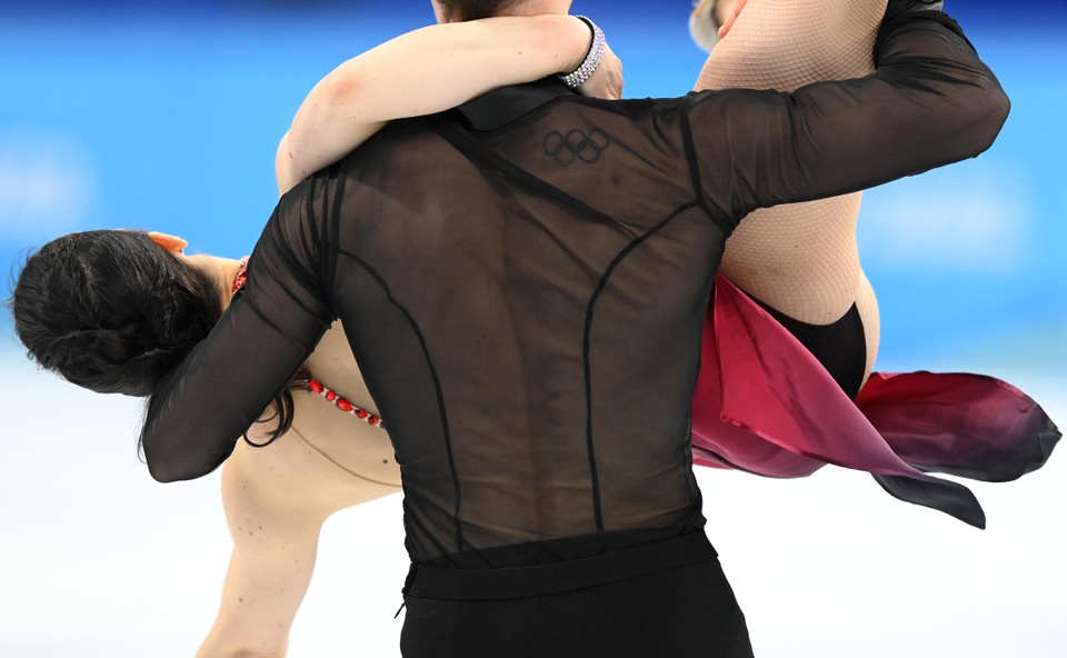 Maksym Spodyriev has the Olympic rings on his back.