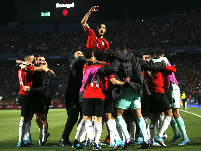 Egyptian players celebrate after Senegal's Salio Ciss scored an own goal on March 25, 2022