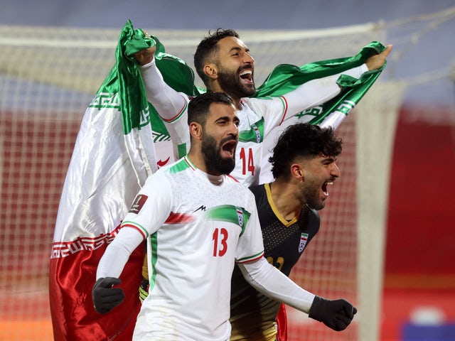 Iran's Saman Kaddous and Hossein Kinani celebrate qualifying for the World Cup on January 27, 2022