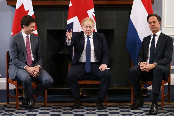 Boris Johnson with Justin Trudeau and Mark Root