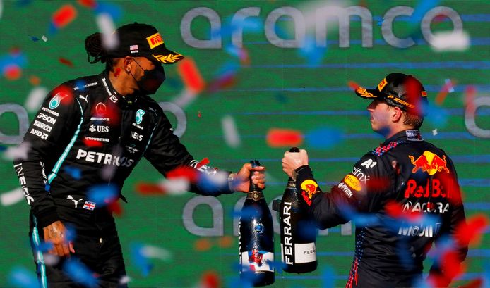 Max Verstappen cheers after his victory in Austin with Lewis Hamilton.