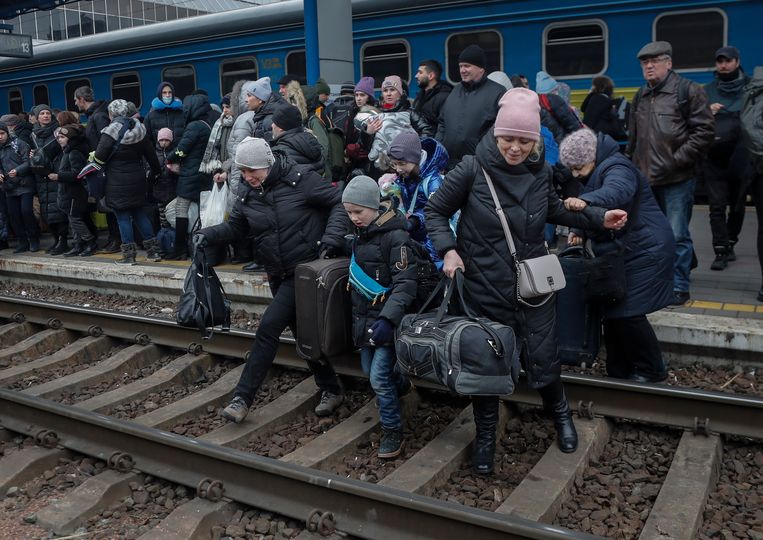 Residents of Kiev cross the tracks on Saturday to join a train that will evacuate them from the Ukrainian capital.  AEP Picture