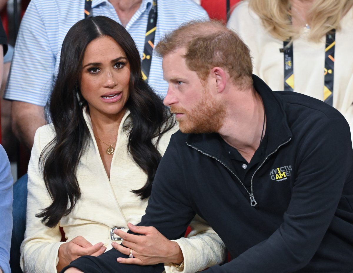 Meghan Markle chats with Prince Harry during a sitting volleyball event at the Invictus Games