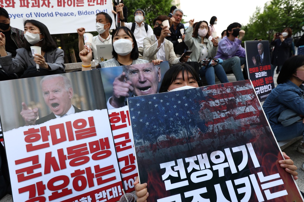 Protesters carried banners during an anti-US demonstration in Seoul on Friday.