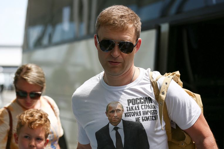 A Russian diplomat suspected of spying is forced to leave Bulgaria.  His T-shirt reads: 