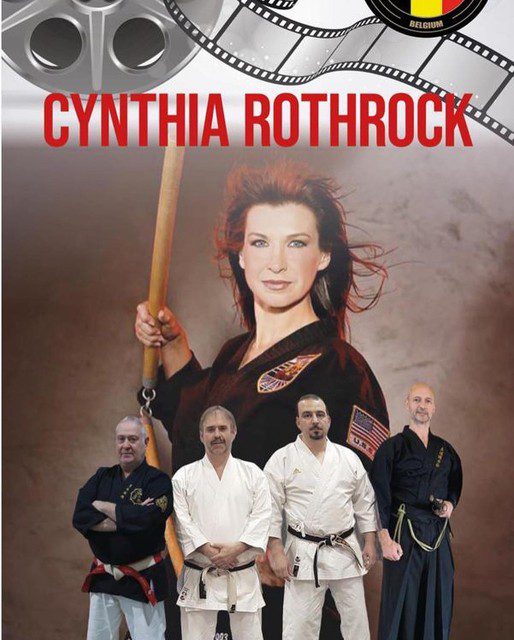 Jean-Pierre Van Vré, Patrick Mees, Kris Teunen, Mohamed Amhaoul and Koen Entbroukx of Imaf in front of a banner of actress and American karate champion Cynthia Rothrock. 
