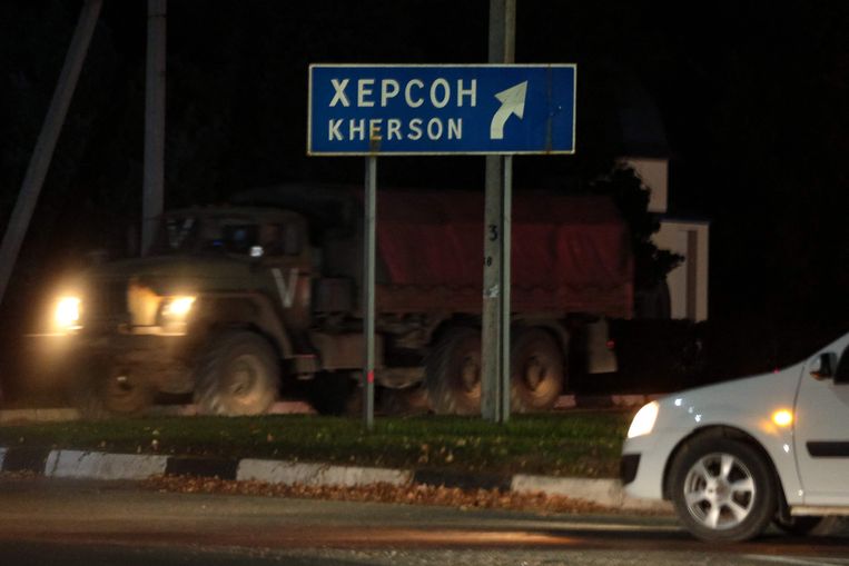A Russian armored car near a sign indicating 